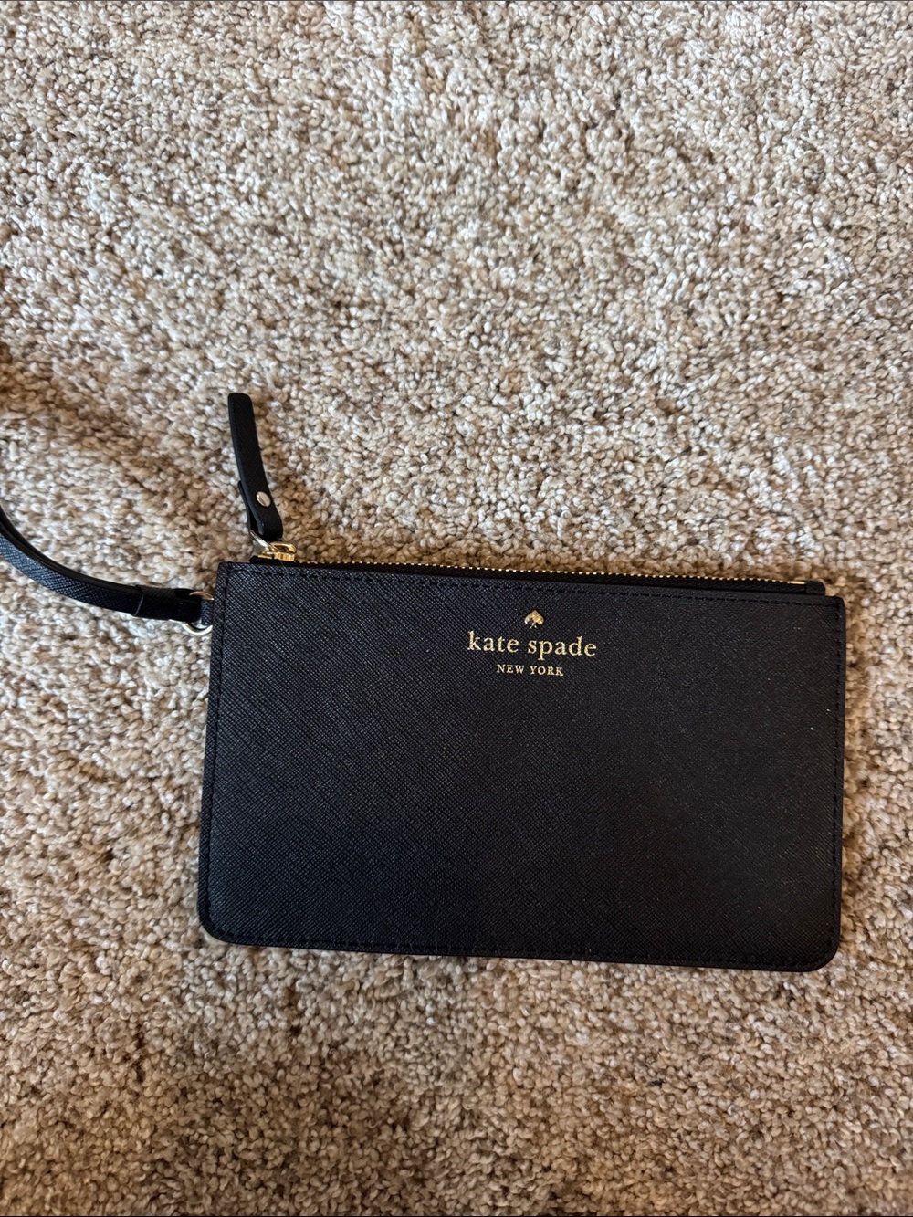 kate spade black saffiano wristlet with gold logo